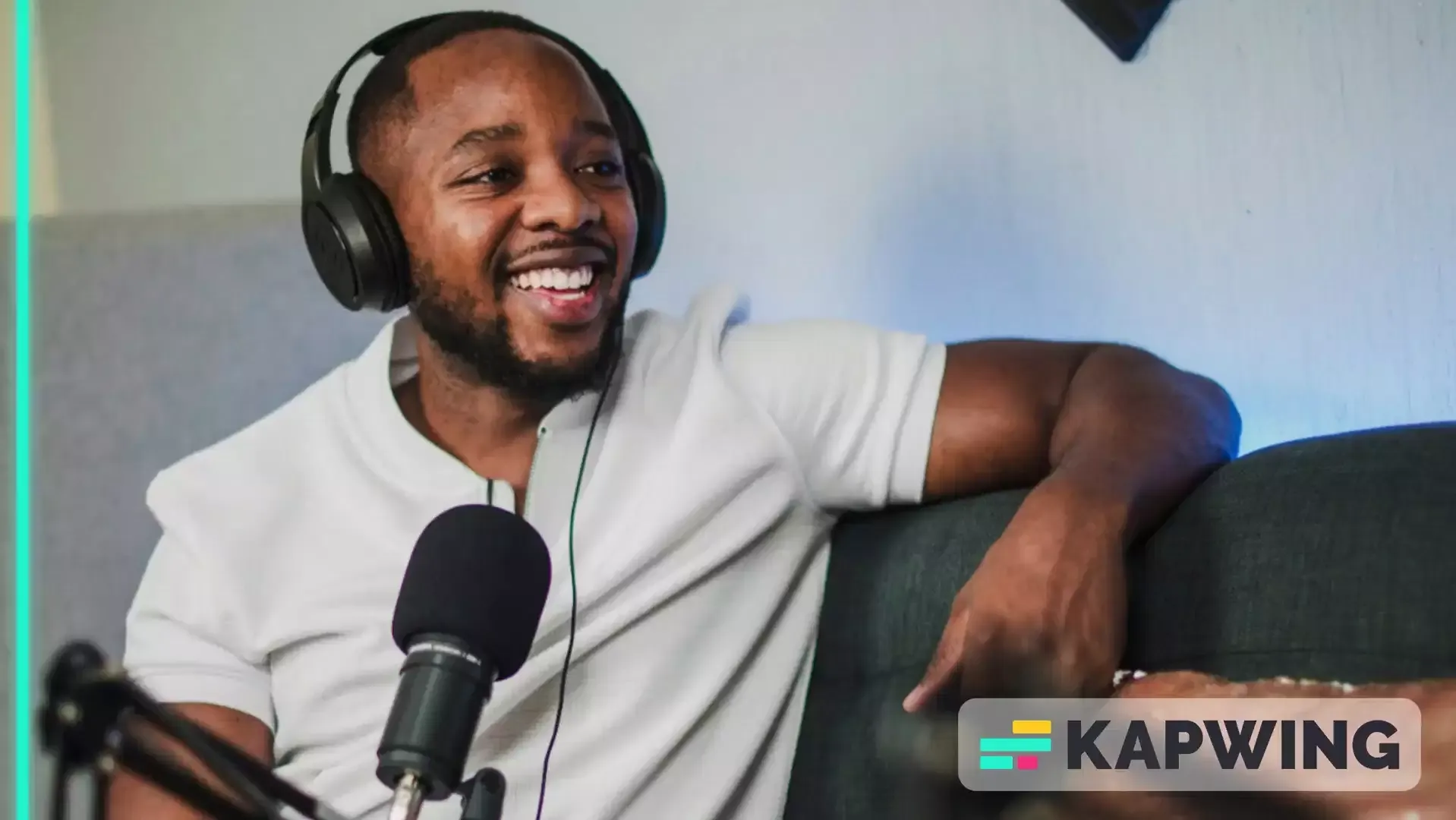 Man wearing headphones recoding in a studio